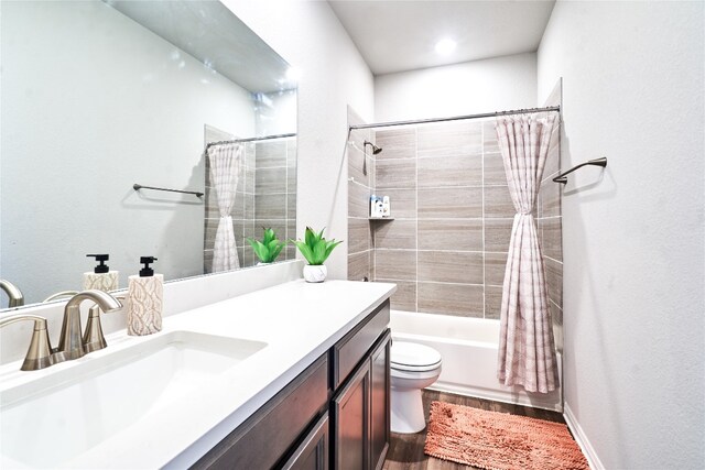 2945 Mill Run Bnd, Round Rock, TX 78665 - bathroom featuring wood finished floors, toilet, vanity, and shower / tub combo with curtain