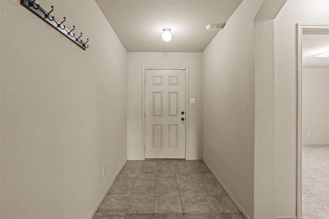 1021 Polmont Ct, Seguin, TX 78155 - doorway to outside featuring a textured ceiling and baseboards