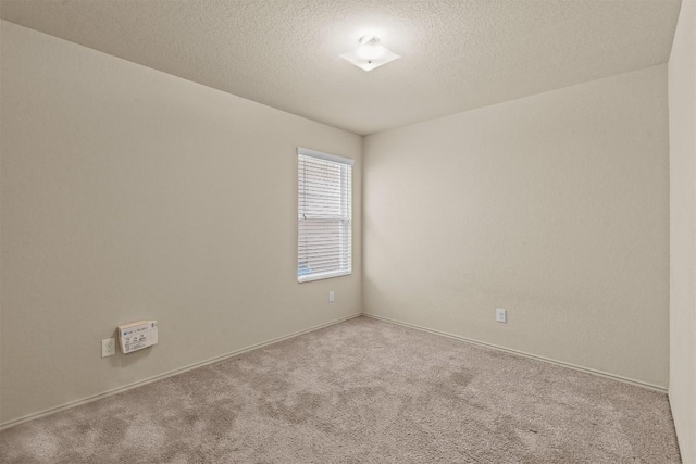 1021 Polmont Ct, Seguin, TX 78155 - unfurnished room featuring a textured ceiling, carpet, and baseboards