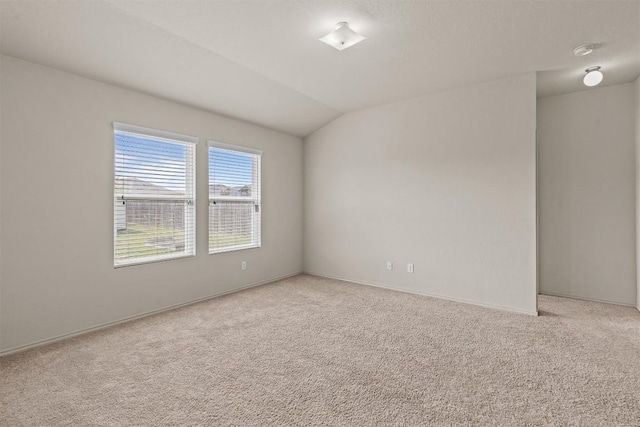 1021 Polmont Ct, Seguin, TX 78155 - unfurnished room featuring light colored carpet, lofted ceiling, and baseboards