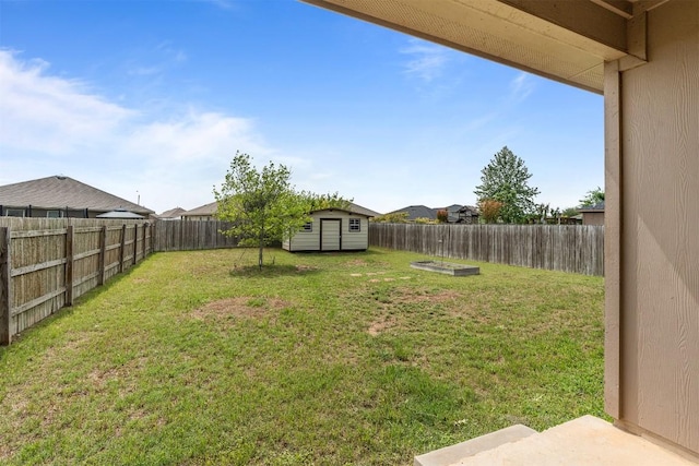 1021 Polmont Ct, Seguin, TX 78155 - view of yard featuring an outdoor structure, a fenced backyard, and a storage unit