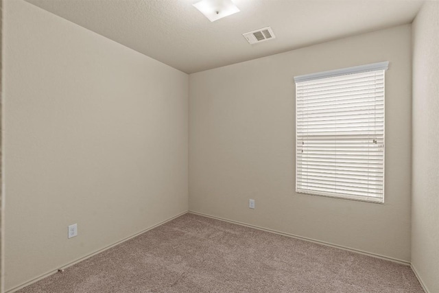 1021 Polmont Ct, Seguin, TX 78155 - empty room with baseboards, carpet flooring, and visible vents