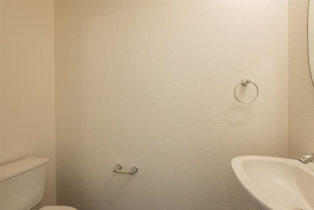 bathroom with a sink and toilet