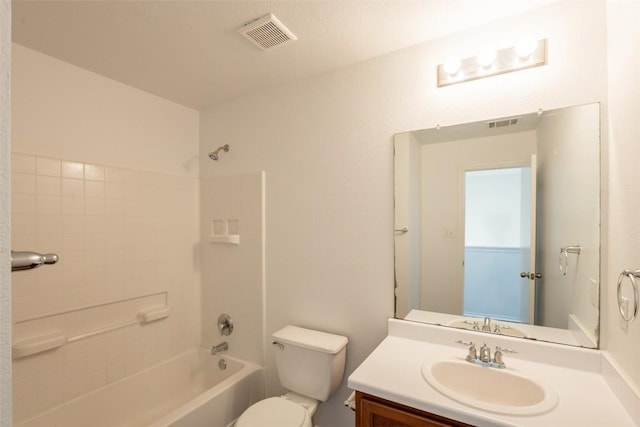 bathroom with toilet, bathing tub / shower combination, vanity, and visible vents