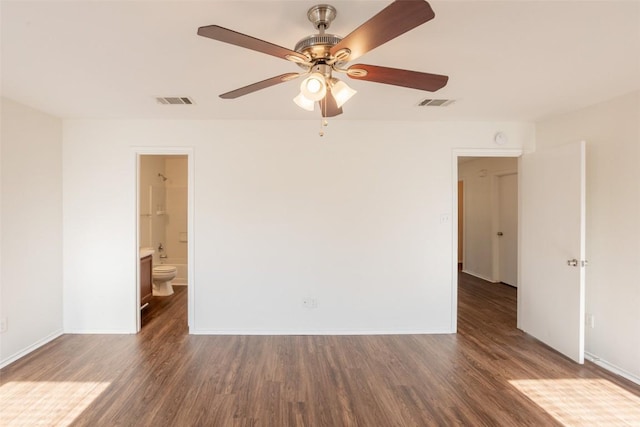 unfurnished bedroom featuring baseboards, visible vents, and wood finished floors
