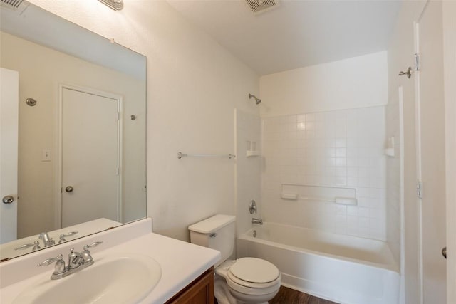 full bath with toilet, vanity, visible vents, and shower / washtub combination