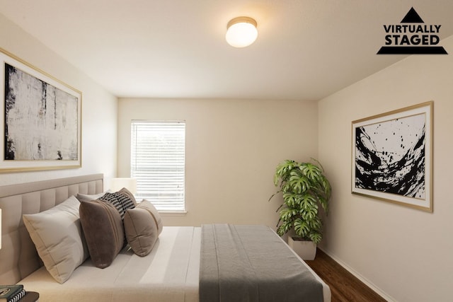 287 Quarter Ave, Buda, TX 78610 - bedroom featuring wood finished floors and baseboards