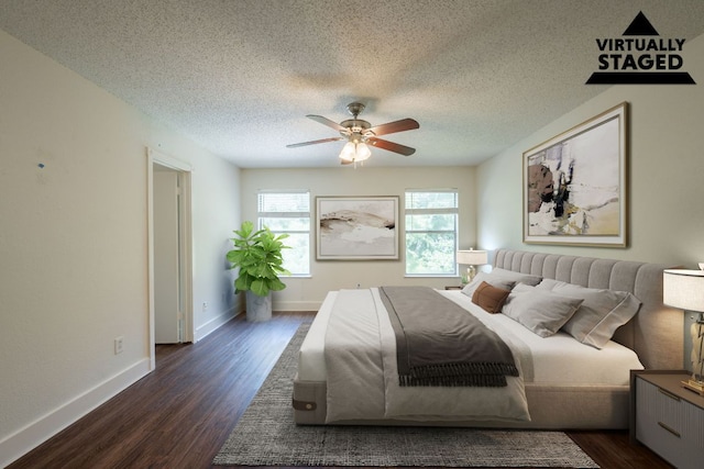 1304 Green Terrace Dr, Round Rock, TX 78664 - bedroom with dark wood-type flooring, a textured ceiling, baseboards, and ceiling fan