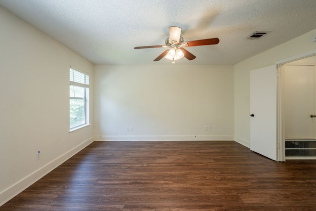1304 Green Terrace Dr, Round Rock, TX 78664 - unfurnished room featuring ceiling fan, dark wood-type flooring, a textured ceiling, and baseboards