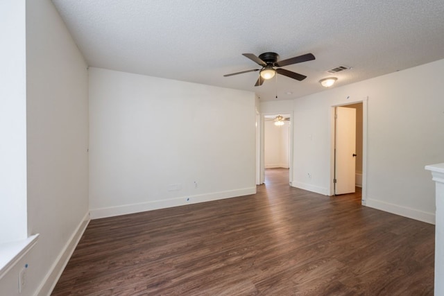 1304 Green Terrace Dr, Round Rock, TX 78664 - spare room with ceiling fan, dark wood finished floors, baseboards, and a textured ceiling