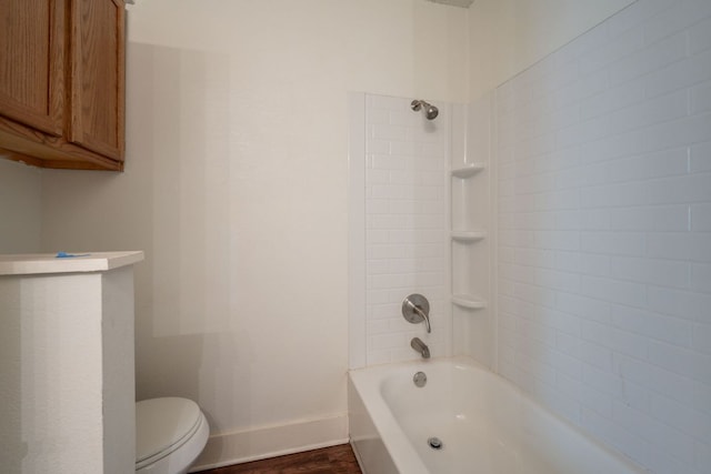 1304 Green Terrace Dr, Round Rock, TX 78664 - bathroom with toilet, baseboards, wood finished floors, and shower / washtub combination