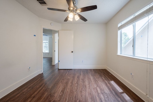 1304 Green Terrace Dr, Round Rock, TX 78664 - spare room with dark wood-type flooring, baseboards, and ceiling fan