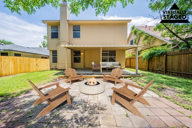 1304 Green Terrace Dr, Round Rock, TX 78664 - back of property with a fire pit, a patio area, and a chimney