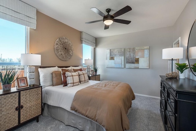 bedroom with carpet, baseboards, and a ceiling fan