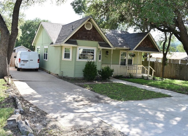 1007 N Bishop St, San Marcos, TX 78666 - view of front of property with a porch, driveway, and roof with shingles