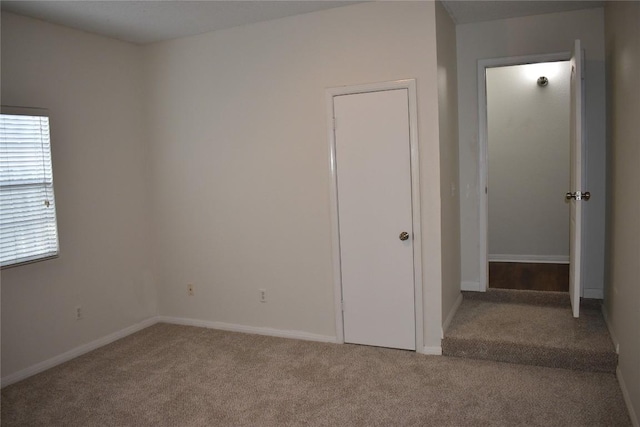 1007 N Bishop St, San Marcos, TX 78666 - unfurnished bedroom featuring carpet and baseboards