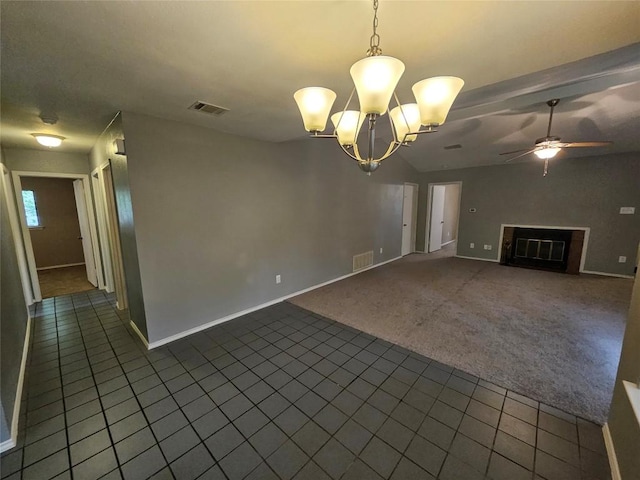 4402 Keota Dr, Austin, TX 78749 - unfurnished living room with baseboards, a fireplace, visible vents, and dark tile patterned floors