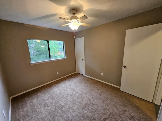 4402 Keota Dr, Austin, TX 78749 - unfurnished bedroom with carpet flooring, a closet, baseboards, and ceiling fan