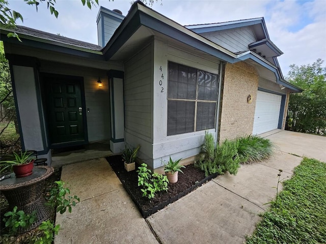 4402 Keota Dr, Austin, TX 78749 - exterior space featuring concrete driveway and a garage