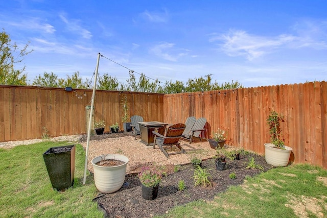 view of yard with a fenced backyard