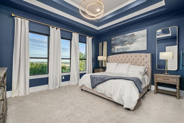 bedroom featuring a notable chandelier, carpet flooring, multiple windows, and crown molding