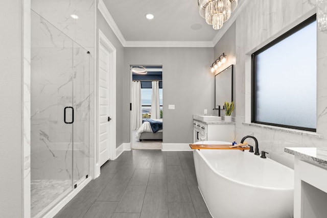 full bath with ornamental molding, ensuite bath, vanity, a soaking tub, and a marble finish shower