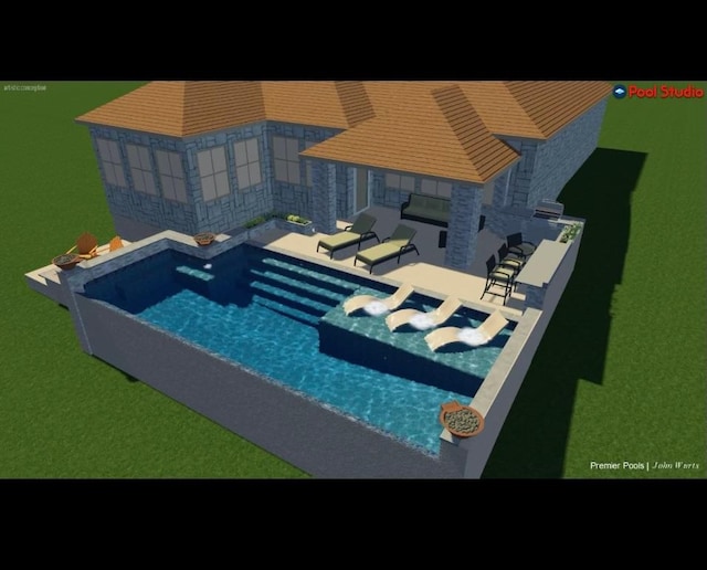 view of swimming pool featuring a patio area and a jacuzzi