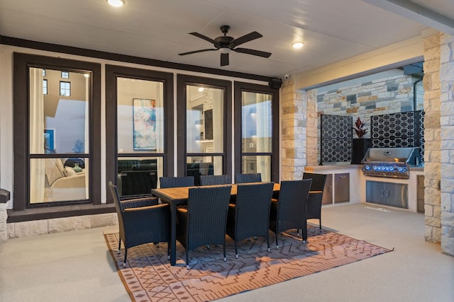 view of patio / terrace featuring area for grilling, outdoor dining area, a grill, and a ceiling fan