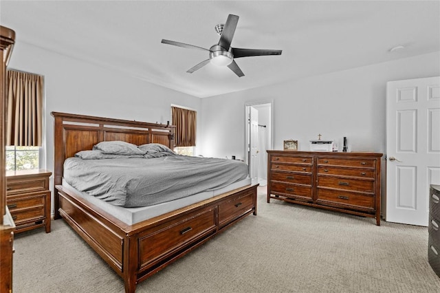bedroom featuring light carpet and ceiling fan