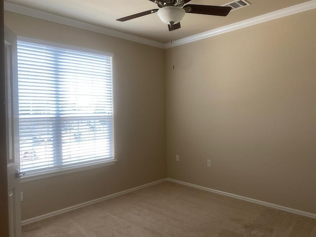 721 Independence Creek Ln, Georgetown, TX 78633 - spare room with light colored carpet, visible vents, a ceiling fan, and ornamental molding