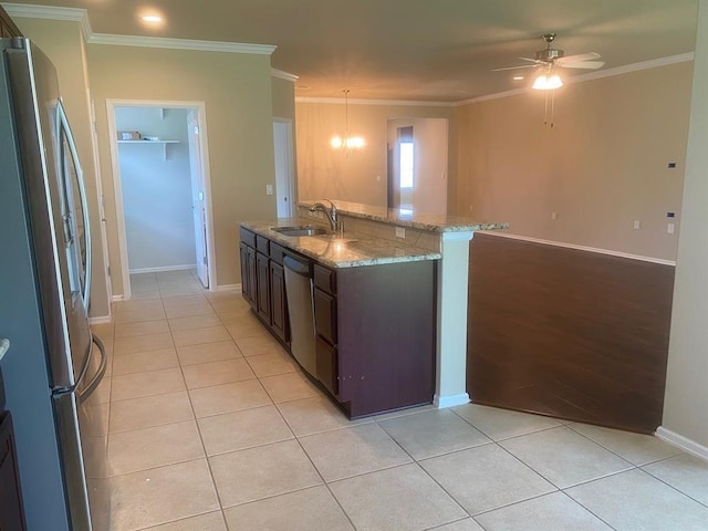721 Independence Creek Ln, Georgetown, TX 78633 - kitchen featuring a sink, dark brown cabinets, light tile patterned floors, and appliances with stainless steel finishes