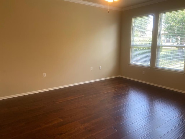 721 Independence Creek Ln, Georgetown, TX 78633 - empty room with crown molding, dark wood finished floors, and baseboards
