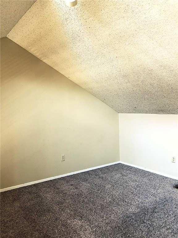2210 Pearl St Unit 304, Austin, TX 78705 - additional living space featuring lofted ceiling, a textured ceiling, carpet floors, and baseboards