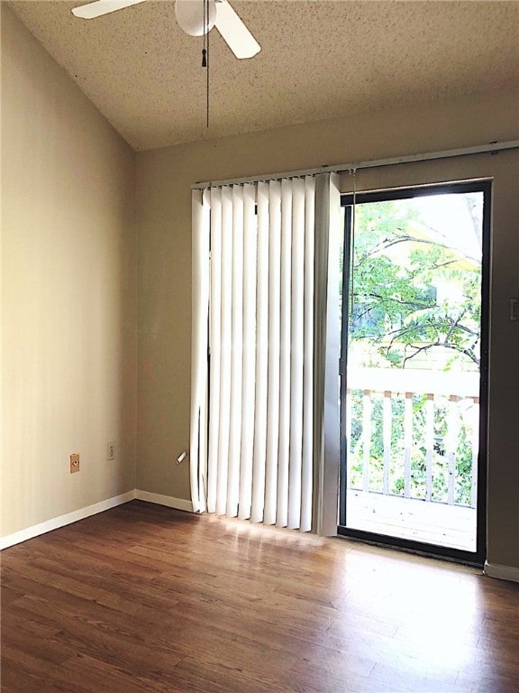 2210 Pearl St Unit 304, Austin, TX 78705 - spare room with ceiling fan, baseboards, and wood finished floors