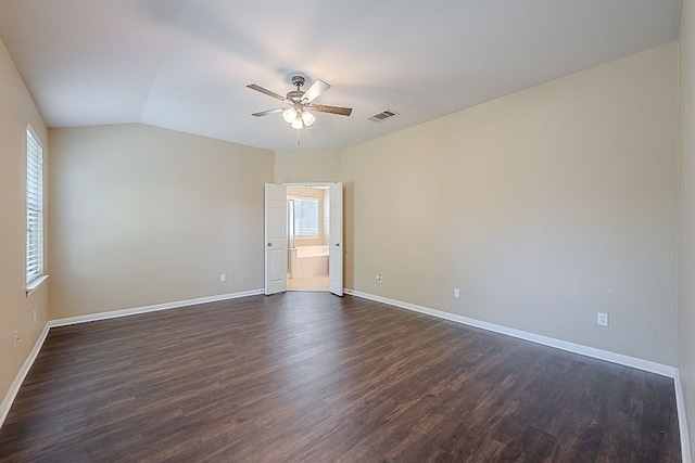 7725 Buckmeadow Dr, Georgetown, TX 78628 - spare room featuring visible vents, vaulted ceiling, ceiling fan, dark wood-style flooring, and baseboards