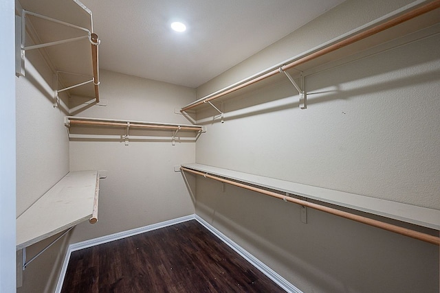 7725 Buckmeadow Dr, Georgetown, TX 78628 - walk in closet featuring dark wood finished floors