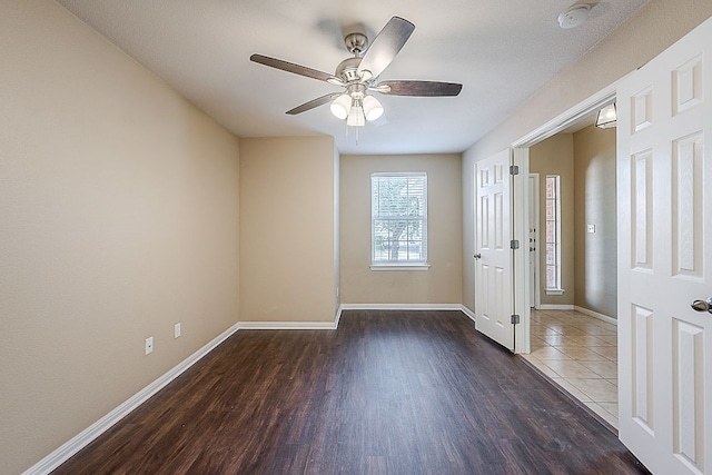 7725 Buckmeadow Dr, Georgetown, TX 78628 - unfurnished room with ceiling fan, baseboards, and wood finished floors
