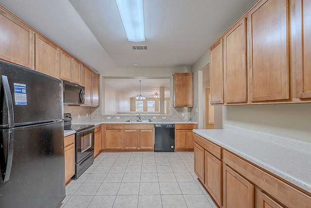 7725 Buckmeadow Dr, Georgetown, TX 78628 - kitchen with a sink, black appliances, visible vents, decorative backsplash, and light tile patterned floors