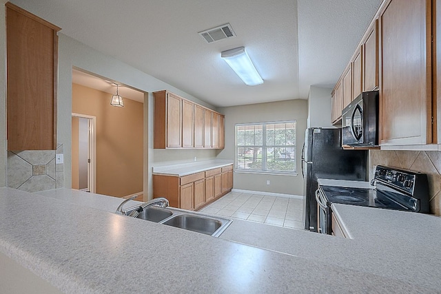 7725 Buckmeadow Dr, Georgetown, TX 78628 - kitchen featuring black appliances, a sink, decorative backsplash, and baseboards