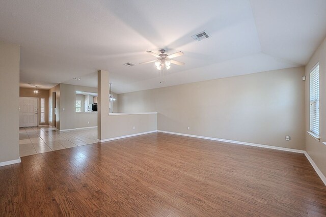 7725 Buckmeadow Dr, Georgetown, TX 78628 - spare room featuring a ceiling fan, baseboards, visible vents, and wood finished floors