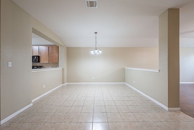 7725 Buckmeadow Dr, Georgetown, TX 78628 - unfurnished dining area featuring light tile patterned floors, a notable chandelier, visible vents, baseboards, and vaulted ceiling