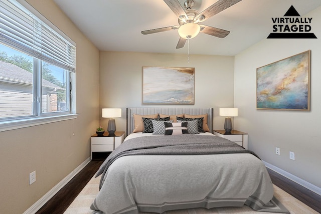 7725 Buckmeadow Dr, Georgetown, TX 78628 - bedroom with wood finished floors, baseboards, and ceiling fan