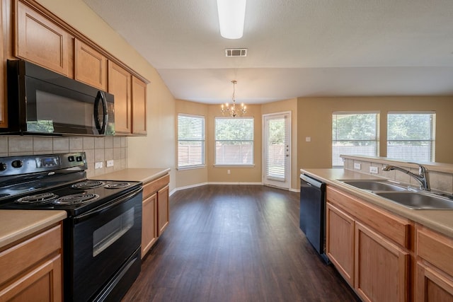 13605 James Garfield St, Manor, TX 78653 - kitchen featuring a sink, visible vents, dark wood-style flooring, black appliances, and a chandelier