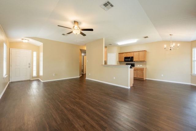 13605 James Garfield St, Manor, TX 78653 - unfurnished living room featuring ceiling fan with notable chandelier, dark wood finished floors, visible vents, baseboards, and vaulted ceiling
