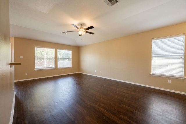 13605 James Garfield St, Manor, TX 78653 - empty room with a ceiling fan, dark wood-style flooring, baseboards, and visible vents