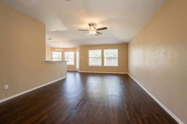 13605 James Garfield St, Manor, TX 78653 - unfurnished room featuring baseboards, dark wood-style flooring, and ceiling fan with notable chandelier