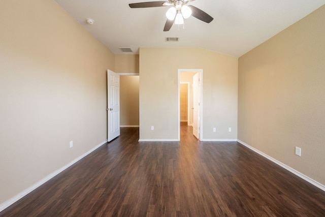13605 James Garfield St, Manor, TX 78653 - unfurnished bedroom with baseboards, dark wood finished floors, visible vents, and vaulted ceiling
