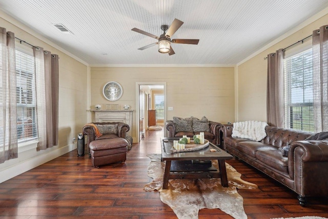 1200 County Road 211, Giddings, TX 78942 - living area featuring ornamental molding, ceiling fan, plenty of natural light, and hardwood / wood-style flooring