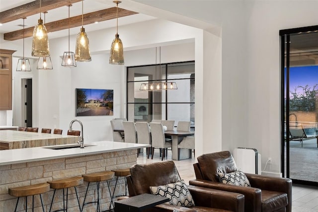 5609 Laceback Ter, Austin, TX 78738 - living room featuring a chandelier and beamed ceiling