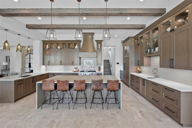 5609 Laceback Ter, Austin, TX 78738 - kitchen with custom range hood, a peninsula, backsplash, a kitchen bar, and recessed lighting